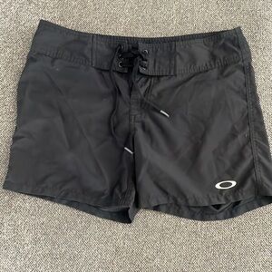 Oakley black water shorts size 1/2. 15” waist, 5” inseam.